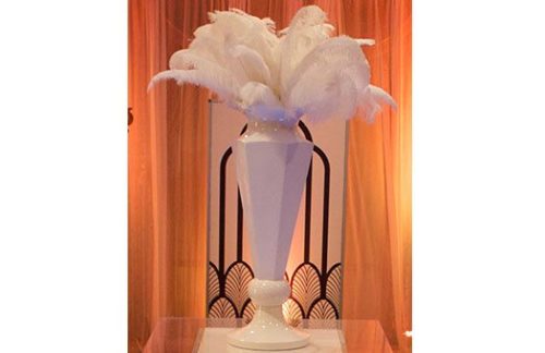 Centerpiece Rentals; Gold Hour Glass Urn with White Feathers