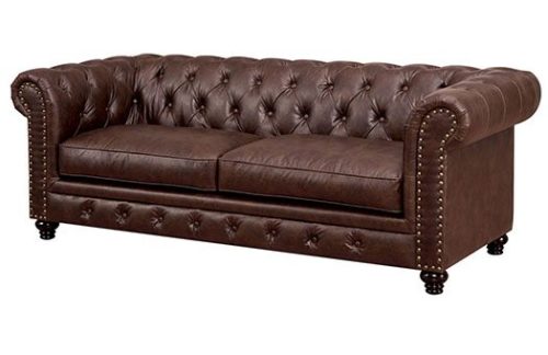 Brown leather sofa with rolled arms and tufted back great for galas and more