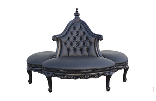 Black round boutique sofa with tufted center column and ornate styling and legs great for galas, themed event, and more