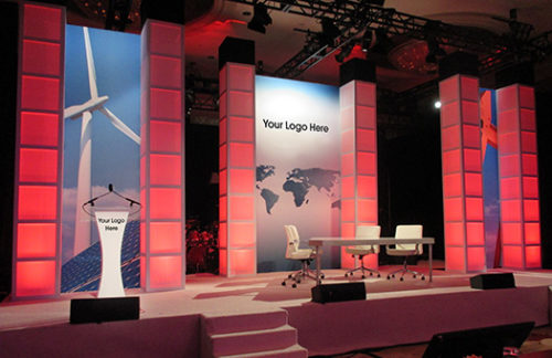 Branded Global Window Wall Stage Set; branded wall with lit columns for a corporate event.