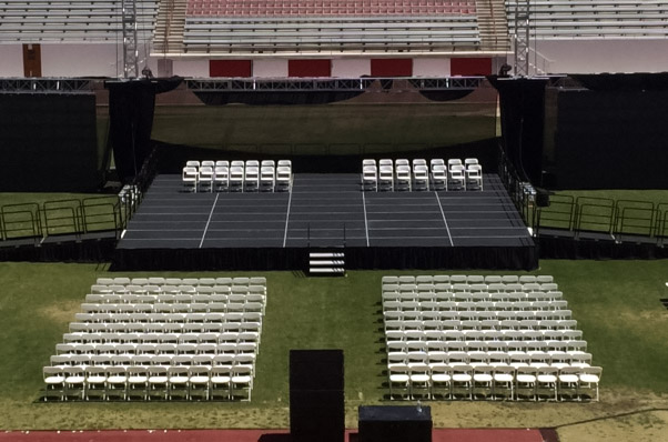 graduation ceremony stage chairs field