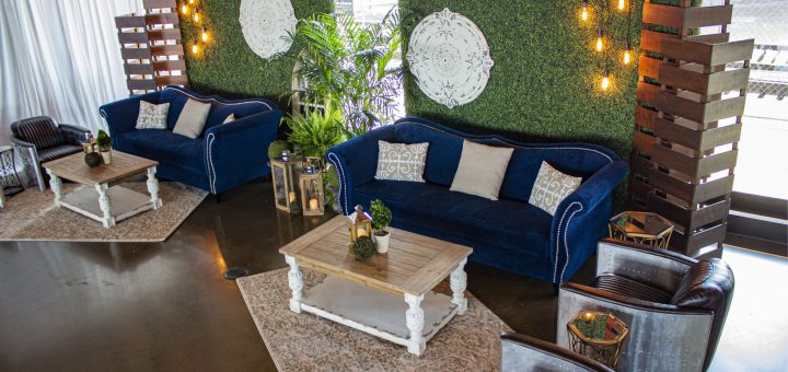 Furniture_Lounge_Zaffiro-Blue-Sofa_Alcott-Coffee-Table_Aviator-Chair_Boxwood-Wall_Market-string-lights_wood-slat-c